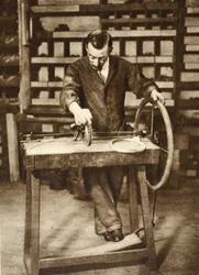 Locksmith winding wire into springs, from Wonderful London, published 1926-27